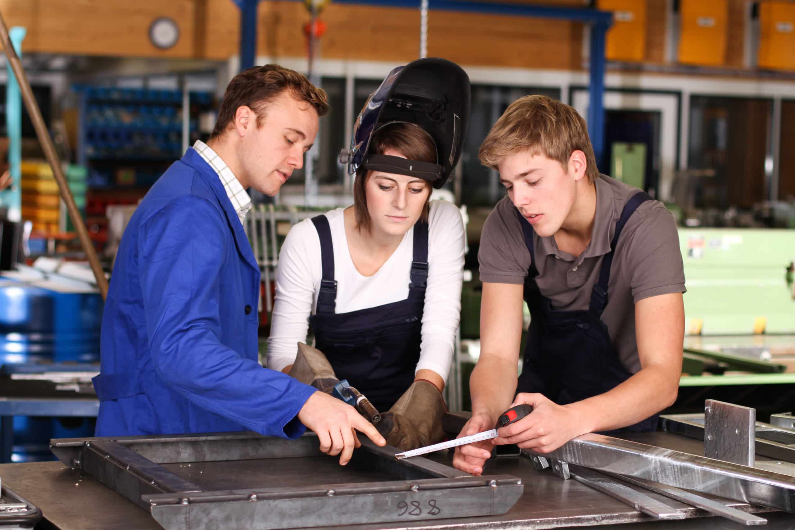 Students learning to weld