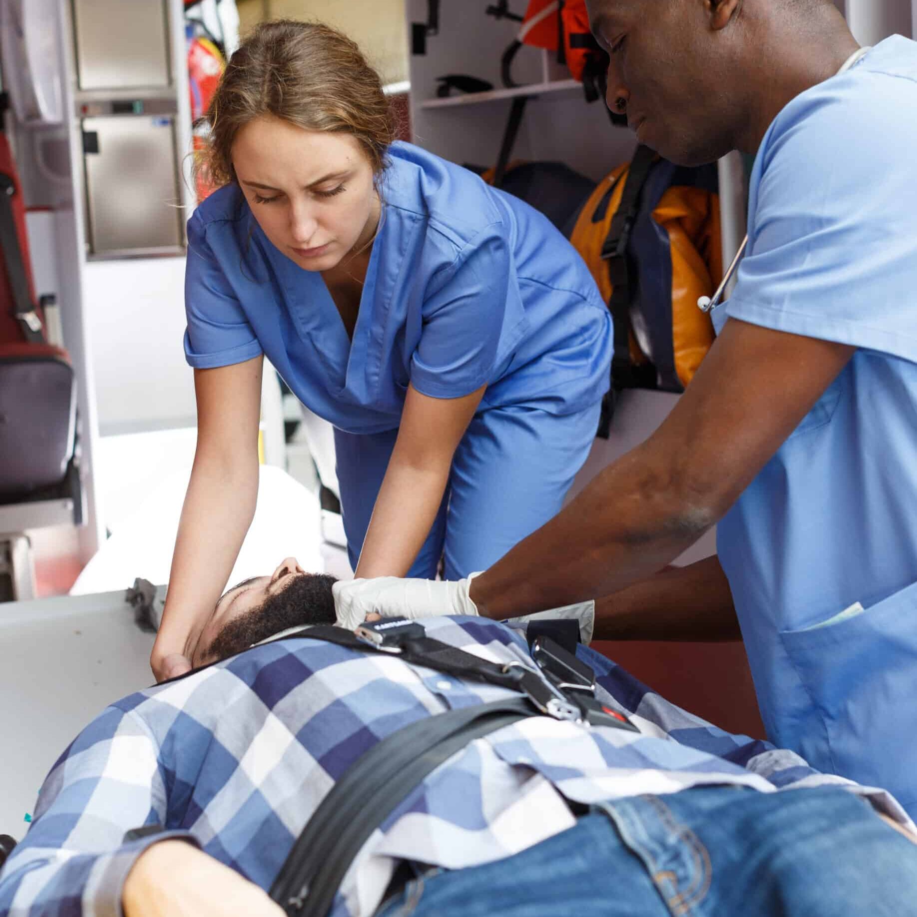 emergency doctors fixing patient on stretcher