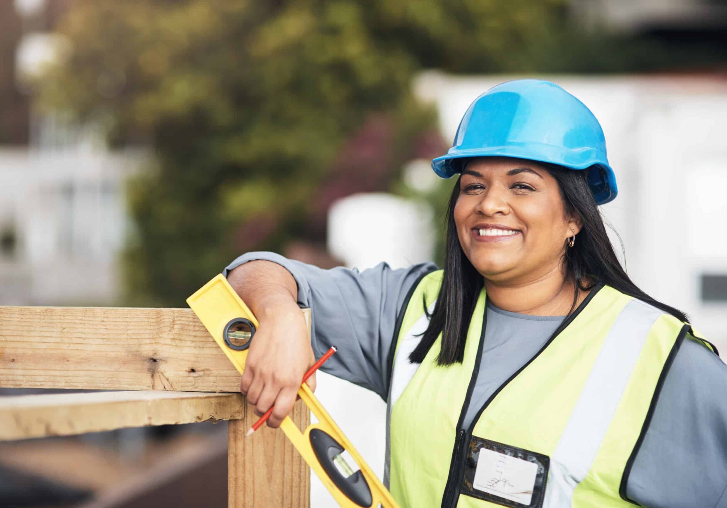 young female construction worker working on site