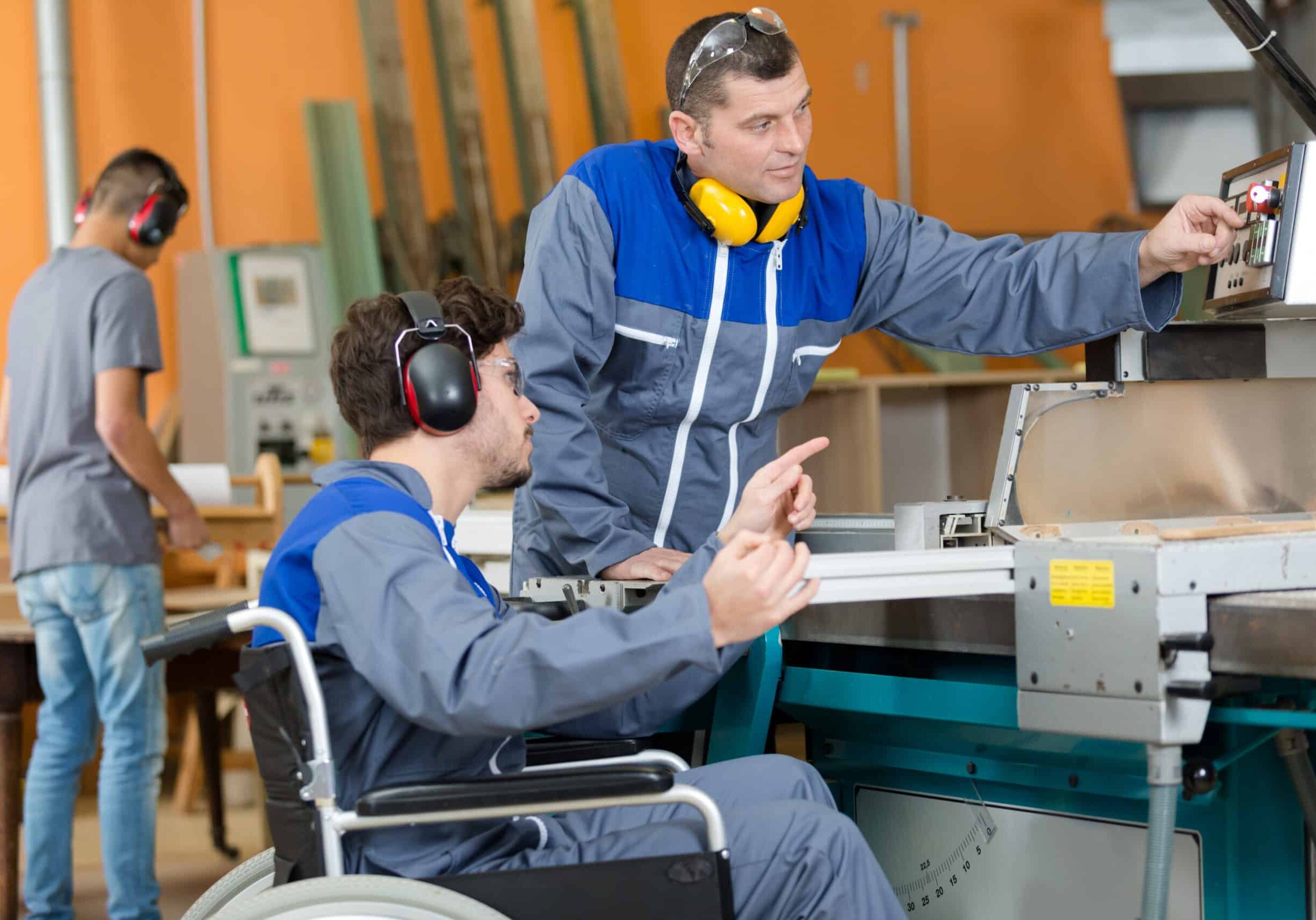 disabled worker in factory getting instructions