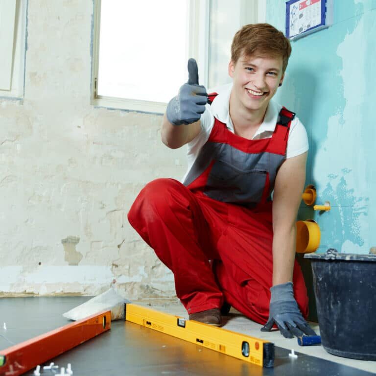 apprentice at work showing thumb up in site apprentice at work showing thumb up in site