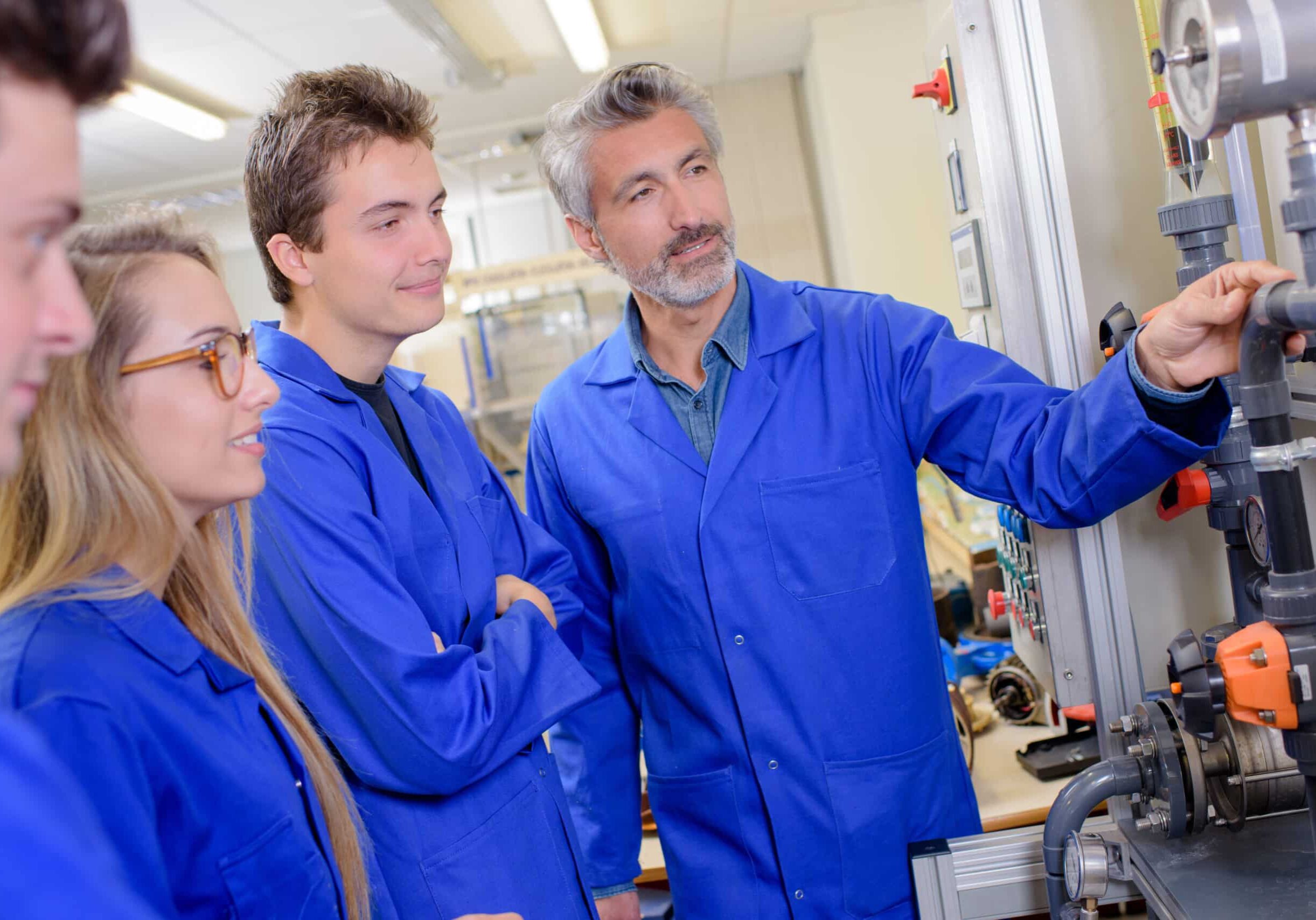 tutor explaining pipework to students