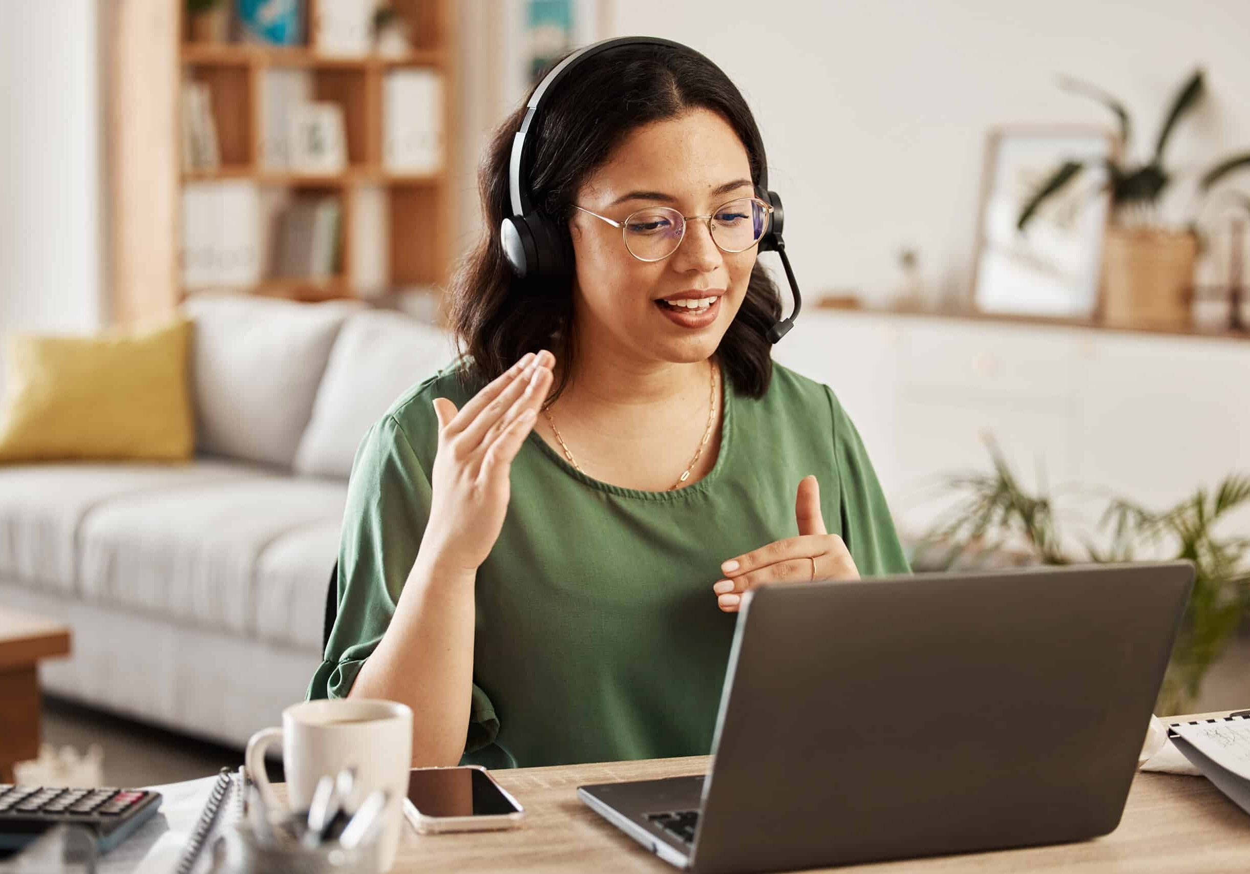 Woman immersed in her work, while wearing headphones Woman immersed in her work, while wearing headphones