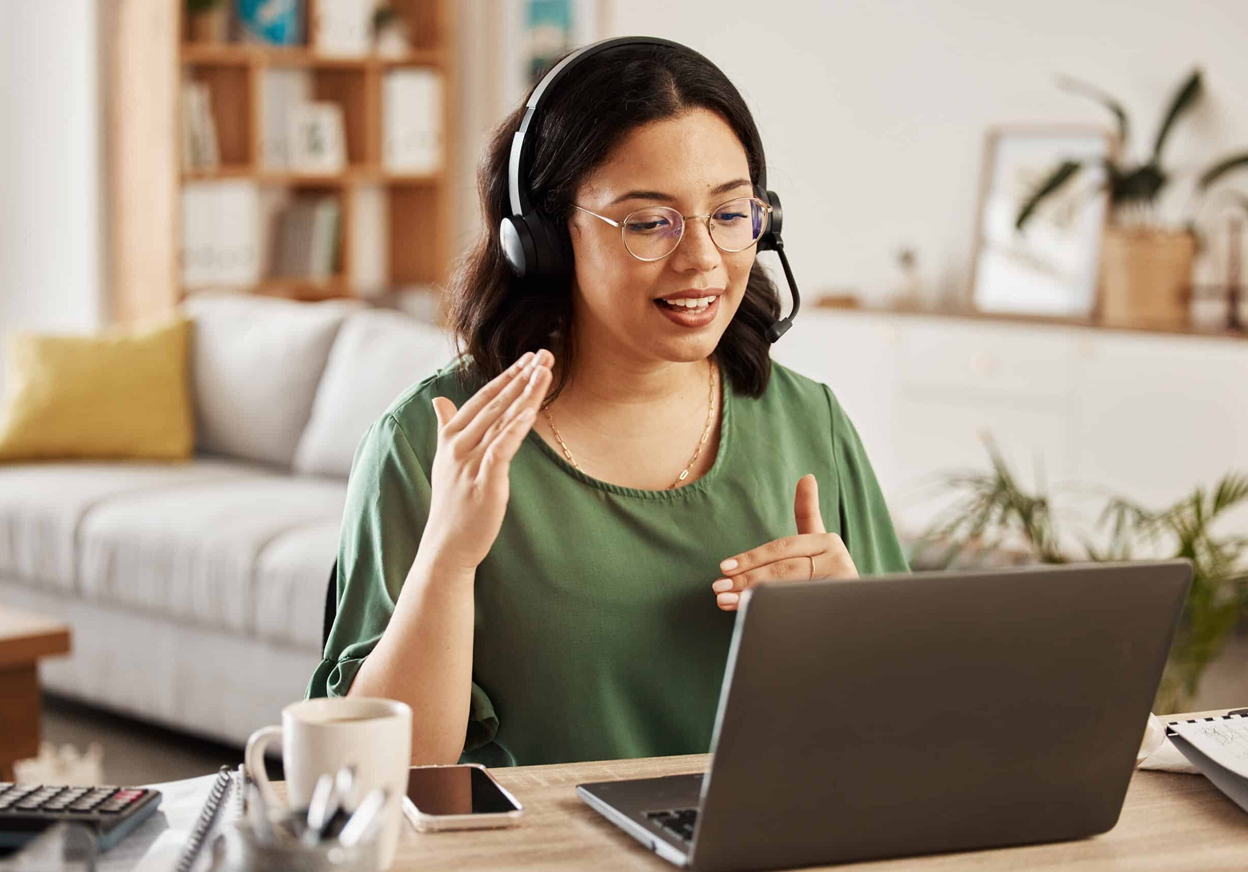 Woman immersed in her work, while wearing headphones